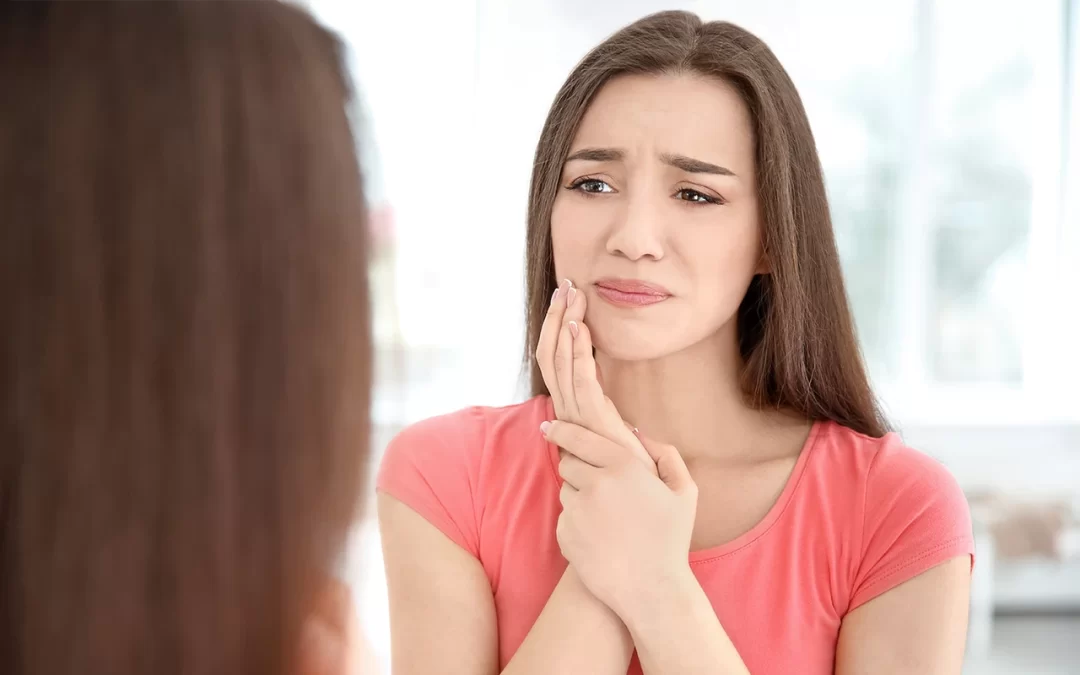Women having a tooth pain at home